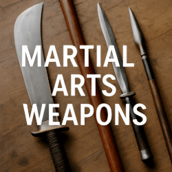 Four traditional martial arts weapons on wooden surface with overlay text reading Martial Arts Weapons
