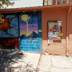 Exterior image of the door to the Hive, community space being used for the low cost qi gong healing clinic.